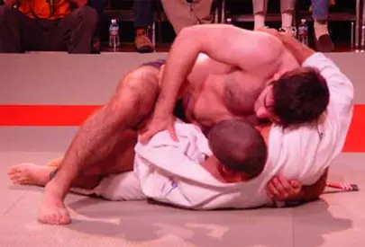 David Avellan controlling Rener Gracie from top position on the mat during their no-time-limit match